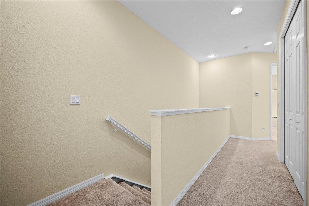 535 Southwest Glen Crest Way Stuart, FL 34997 - Photo 12 of 32 a view of hallway with stairs