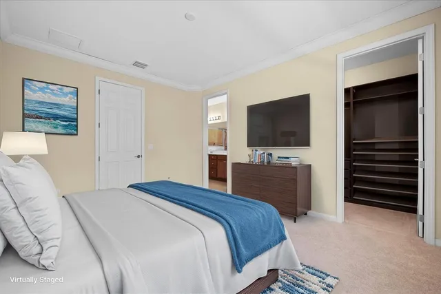 a bedroom with a bed and a flat screen tv in the kitchen