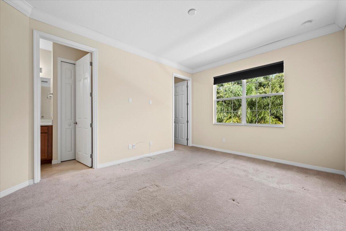 535 Southwest Glen Crest Way Stuart, FL 34997 - Photo 14 of 32 an empty room with windows and closet