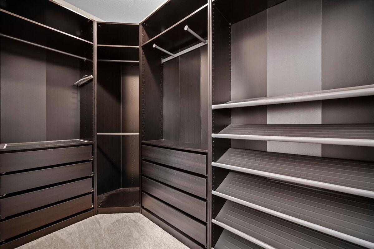 535 Southwest Glen Crest Way Stuart, FL 34997 - Photo 15 of 32 a view of walk in closet with empty racks