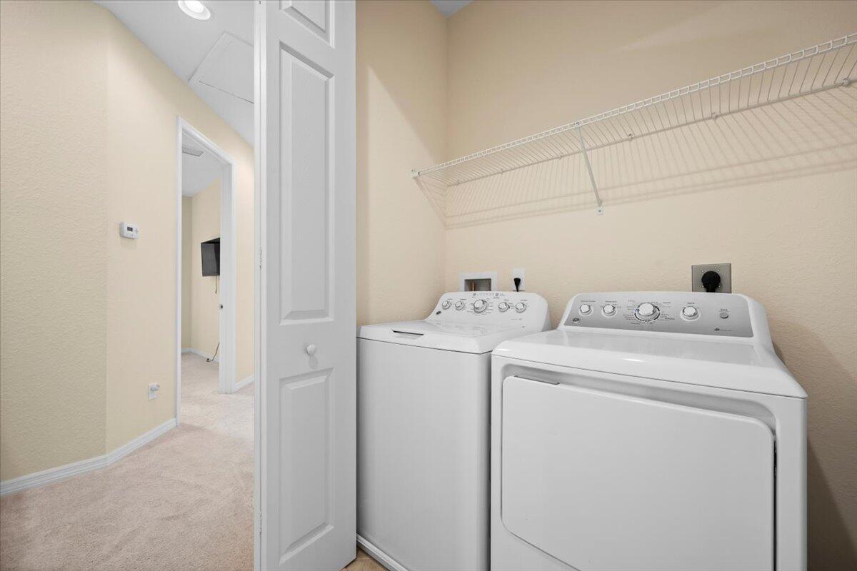 535 Southwest Glen Crest Way Stuart, FL 34997 - Photo 20 of 32 a view of storage and utility room with washer and dryer