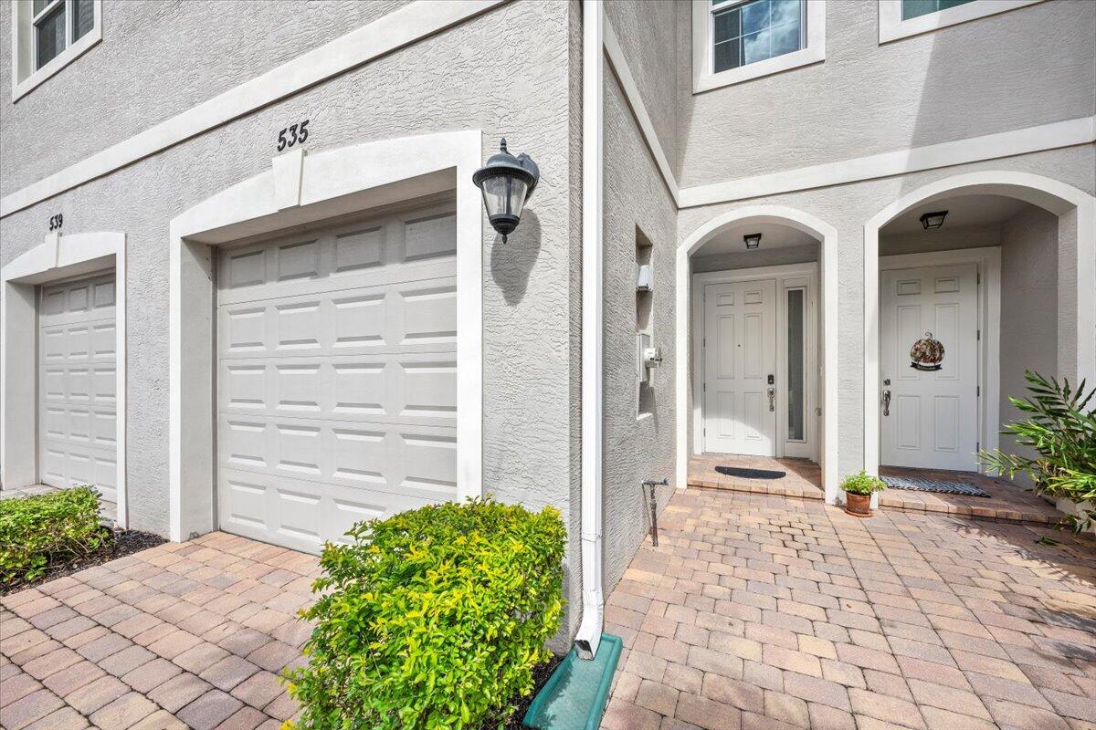 535 Southwest Glen Crest Way Stuart, FL 34997 - Photo 5 of 32 a view of a entryway door of the house