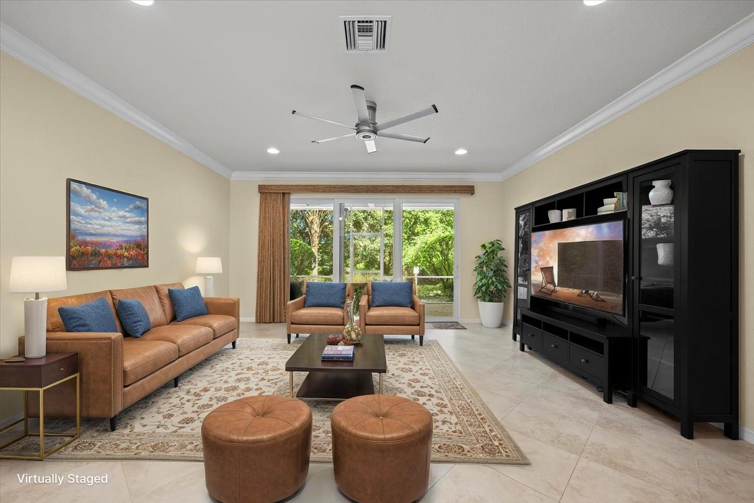 535 Southwest Glen Crest Way Stuart, FL 34997 - Photo 8 of 32 a living room with furniture and a flat screen tv