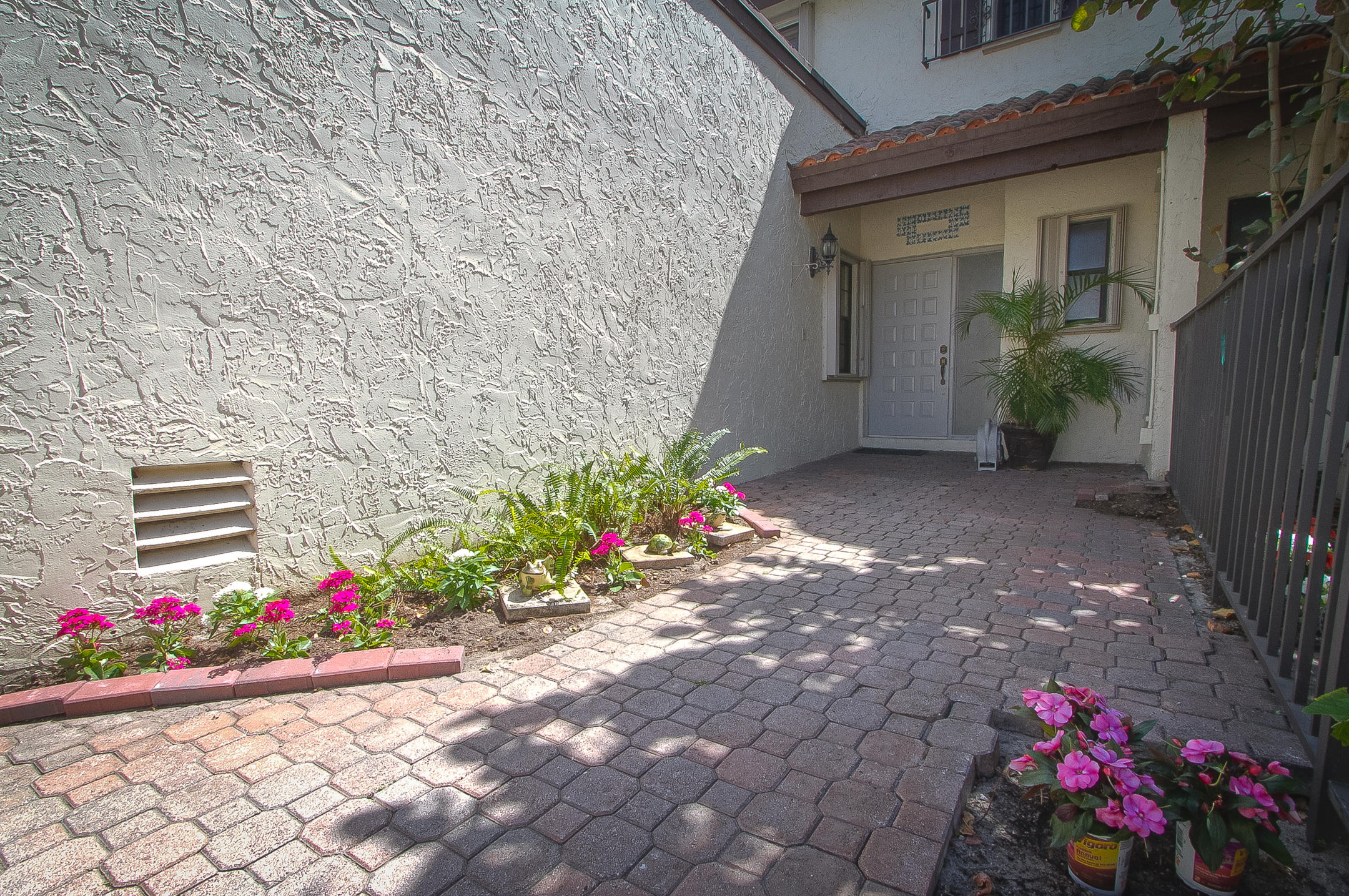 454 Ashwood Place Boca Raton, FL 33431 - Photo 2 of 30 a front view of a house with a yard