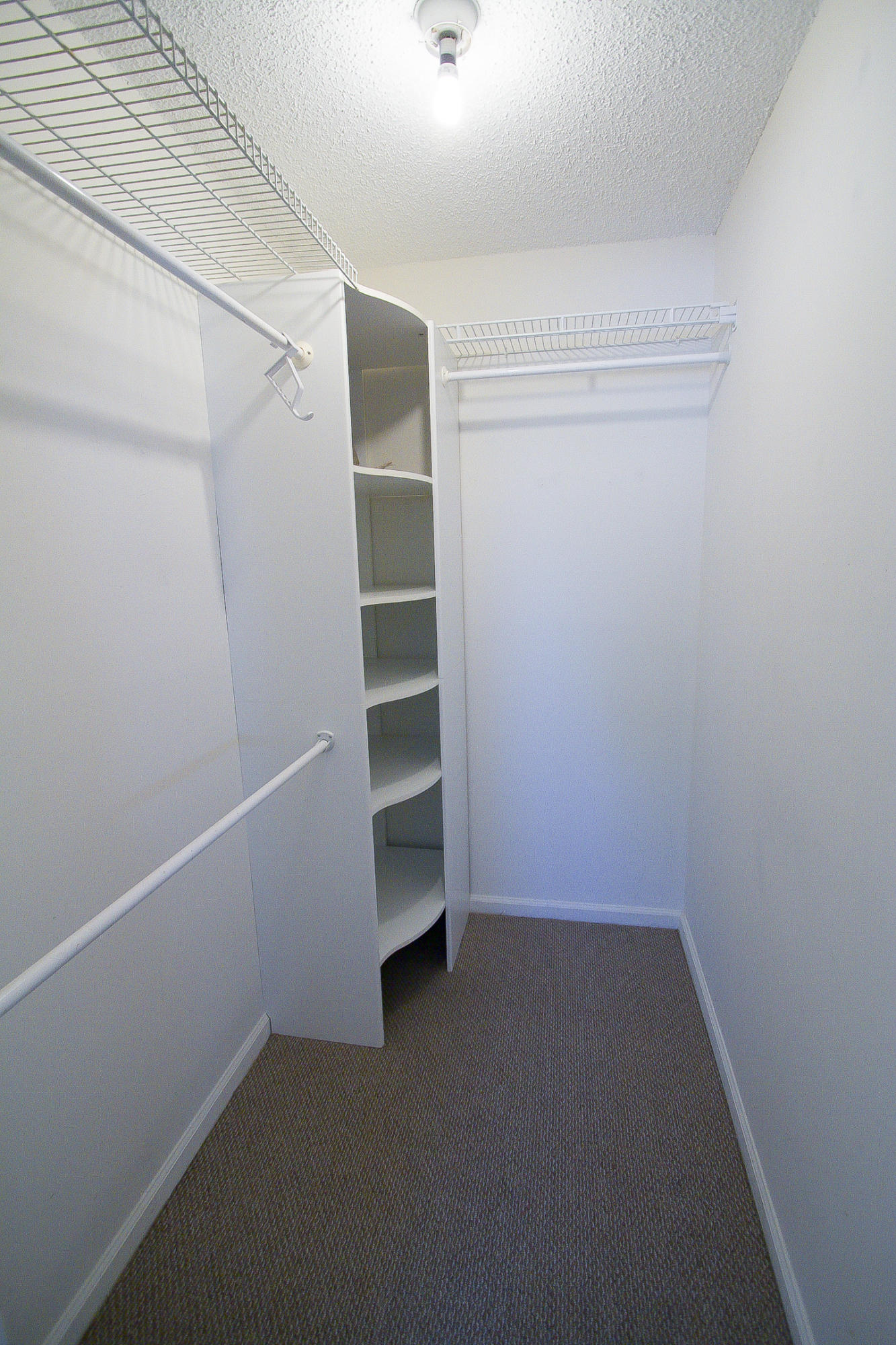454 Ashwood Place Boca Raton, FL 33431 - Photo 21 of 30 a view of walk in closet with empty racks