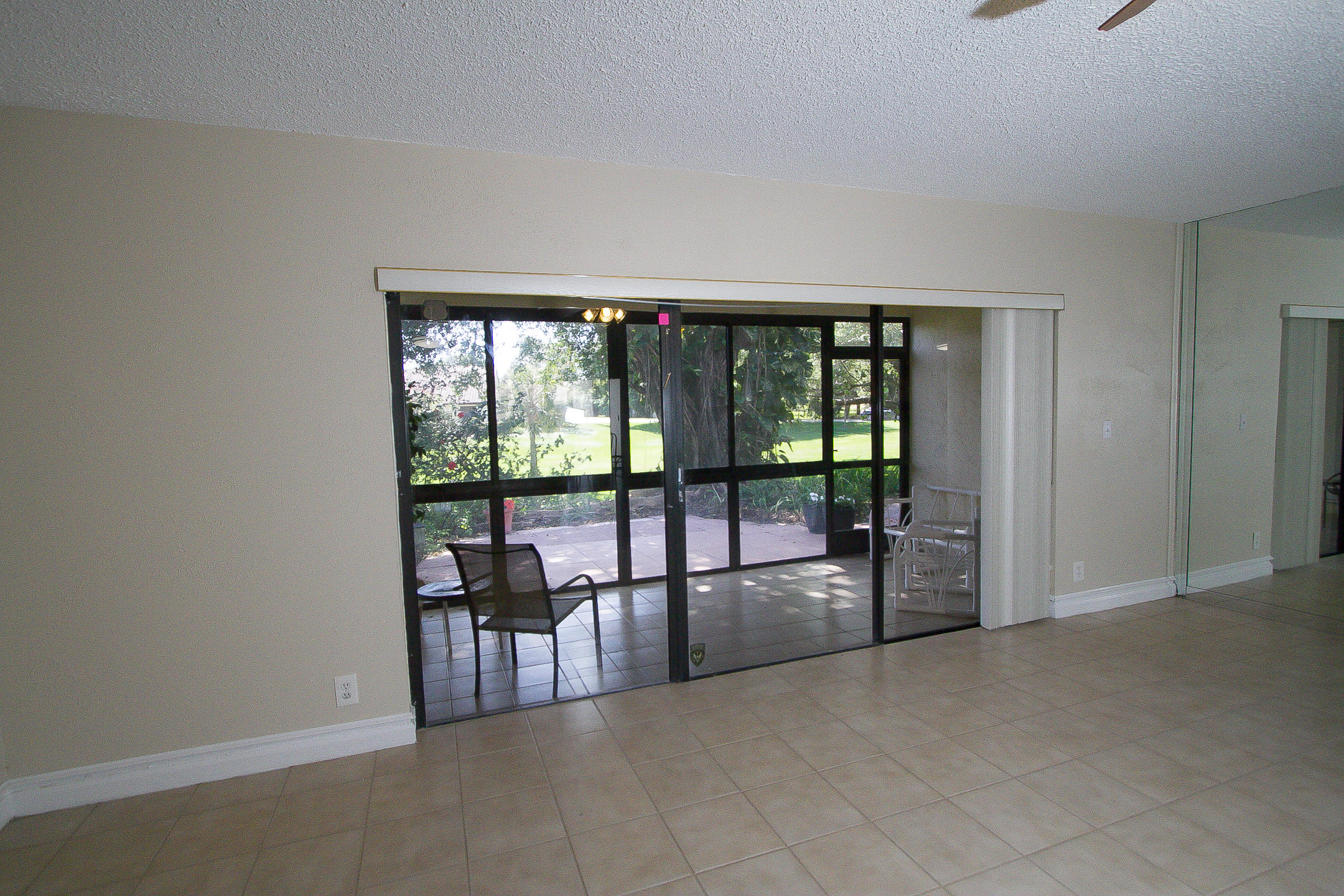454 Ashwood Place Boca Raton, FL 33431 - Photo 5 of 30 a view of a room with large windows