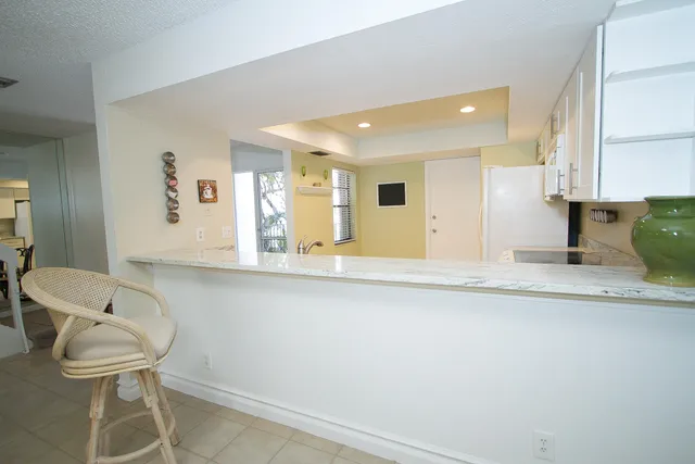 a bathroom with a sink and mirror with toilet