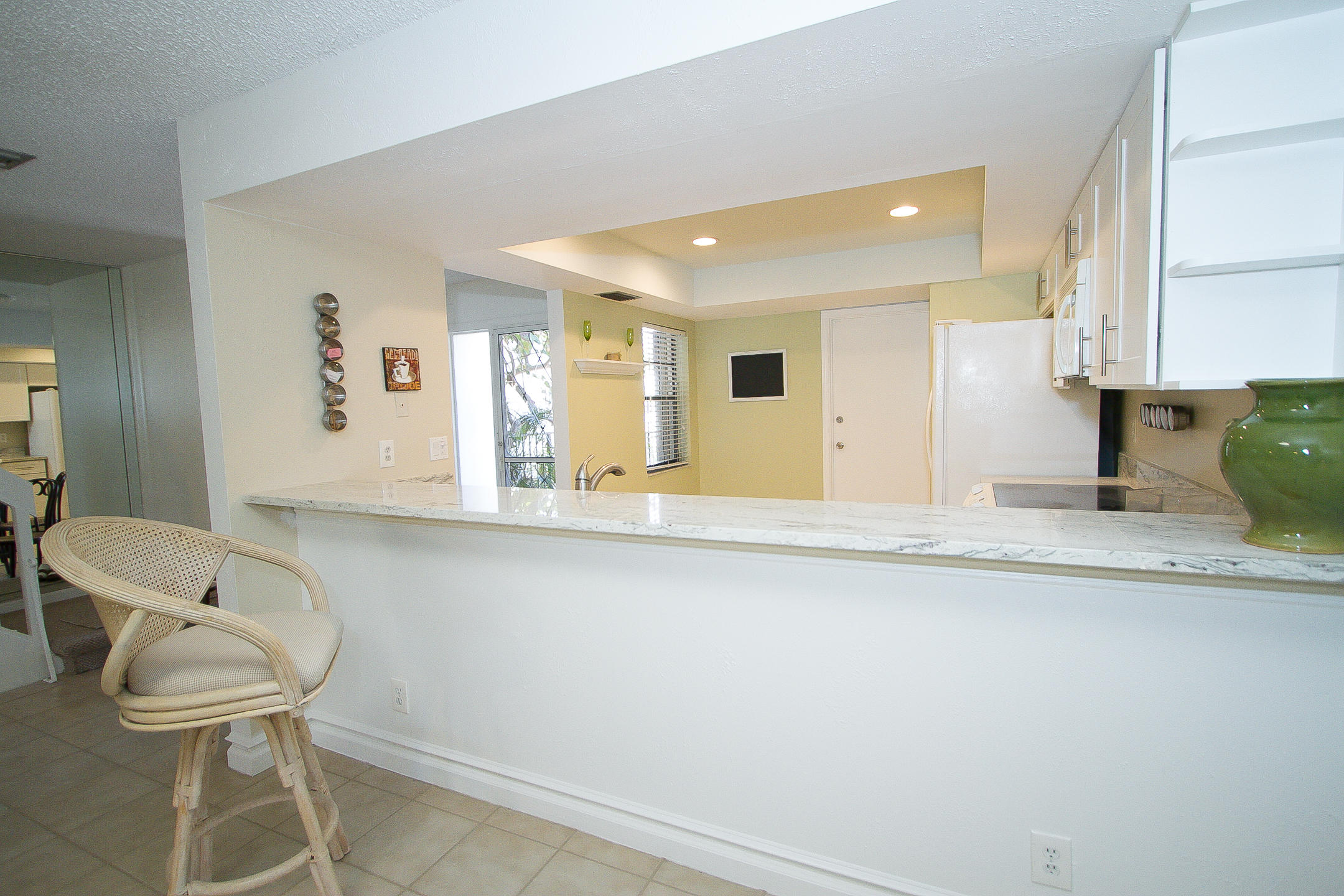 454 Ashwood Place Boca Raton, FL 33431 - Photo 6 of 30 a bathroom with a sink and mirror with toilet