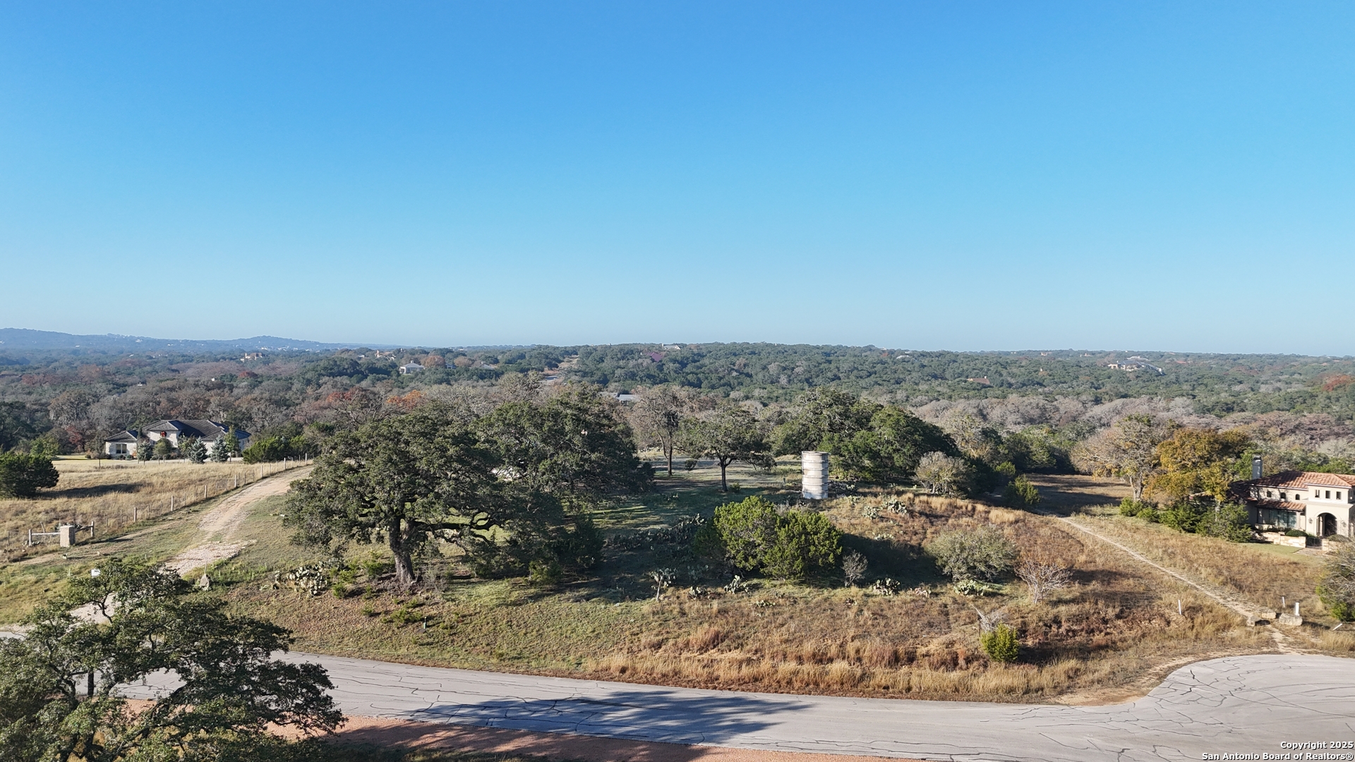 82 Swede Springs Boerne, TX 78006 - Photo 2 of 17 a view of a dry yard with wooden fence