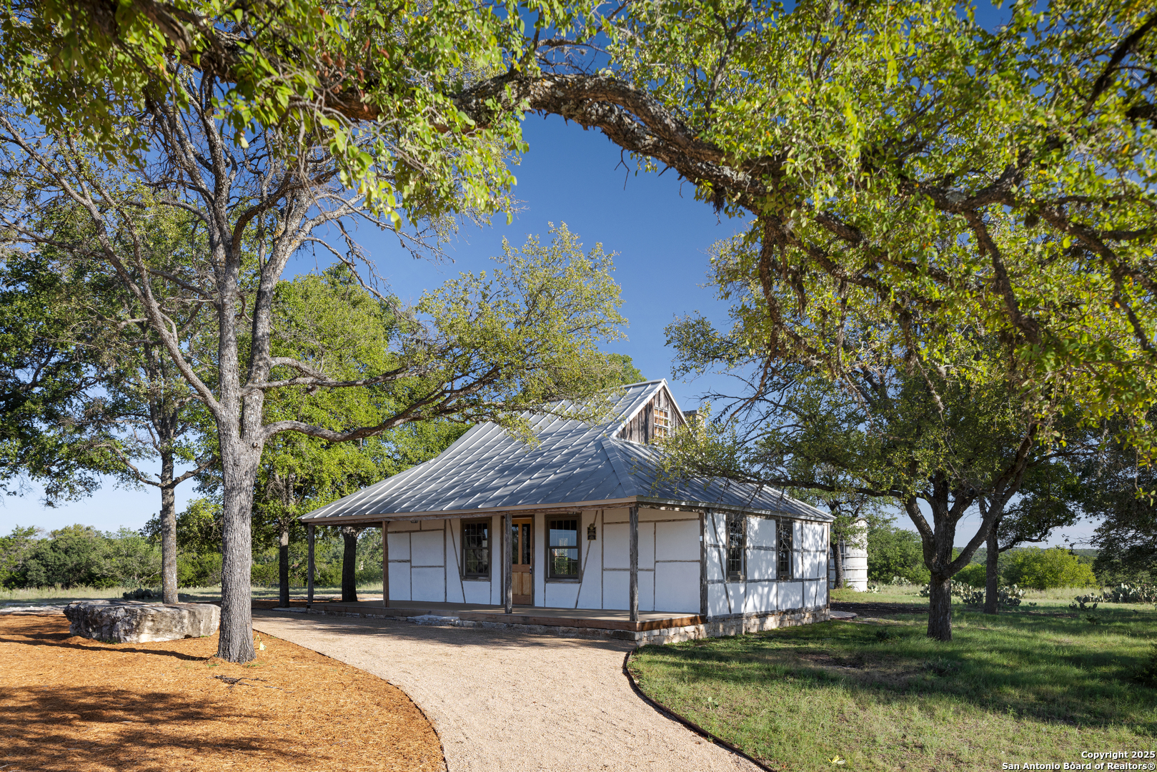 82 Swede Springs Boerne, TX 78006 - Photo 5 of 17 a front view of a house with a garden