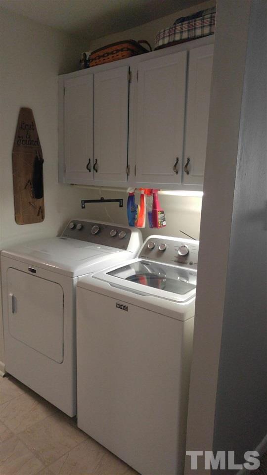 5114 Flint Ridge Place, Unit 5114 Raleigh, NC 27609 - Photo 4 of 9 a utility room with dryer and washer