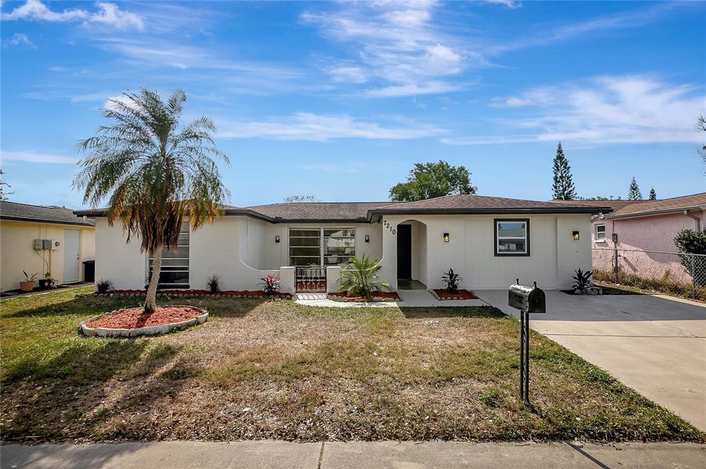 a front view of house with yard space and porch