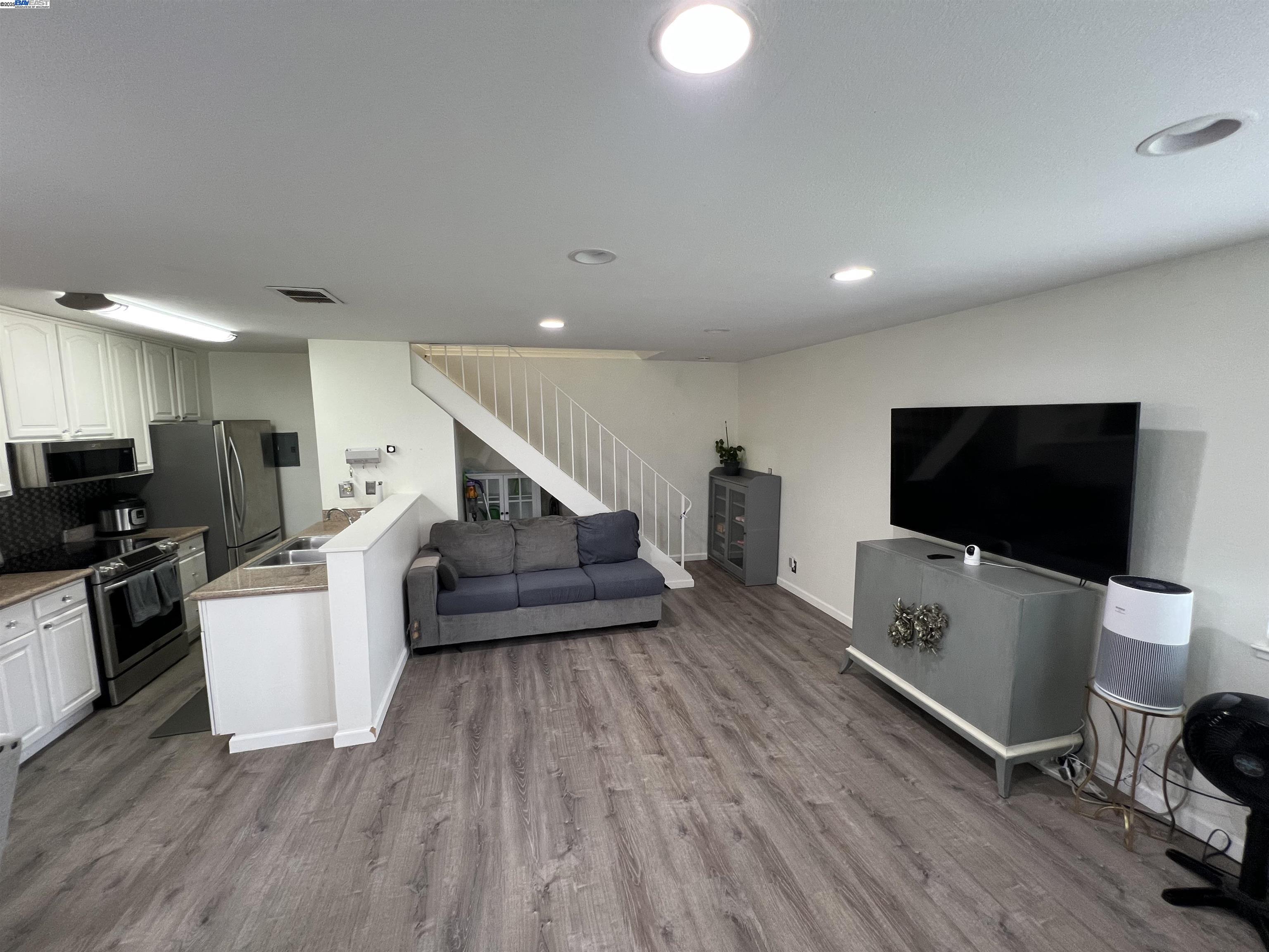 2221 Partridge Way, Unit 3 Union City, CA 94587 - Photo 7 of 11 a living room with furniture and a flat screen tv
