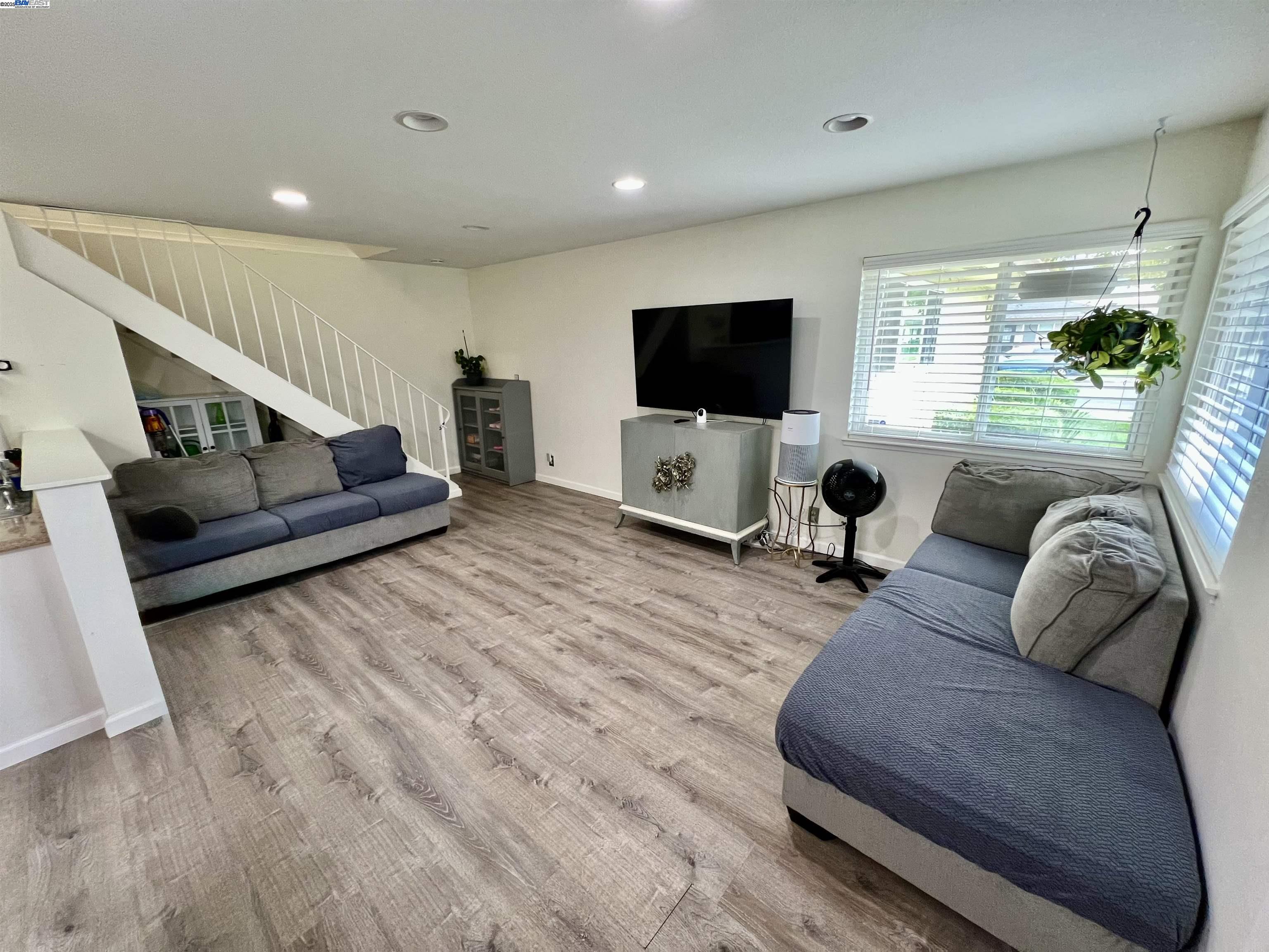 2221 Partridge Way, Unit 3 Union City, CA 94587 - Photo 8 of 11 a living room with furniture and a flat screen tv