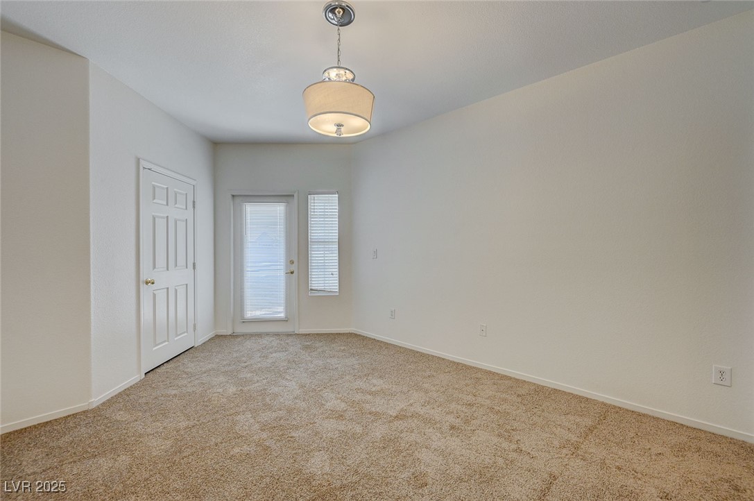 6160 Rumrill Street, Unit 232 Las Vegas, NV 89113 - Photo 13 of 26 Unfurnished bedroom featuring carpet floors and baseboards