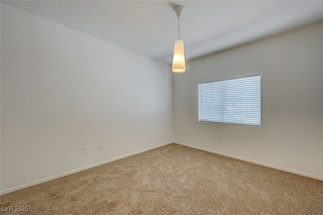 6160 Rumrill Street, Unit 232 Las Vegas, NV 89113 - Photo 19 of 26 Empty room featuring baseboards and carpet floors