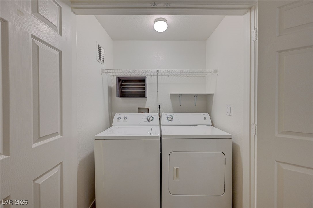 6160 Rumrill Street, Unit 232 Las Vegas, NV 89113 - Photo 24 of 26 Laundry area with washer and clothes dryer
