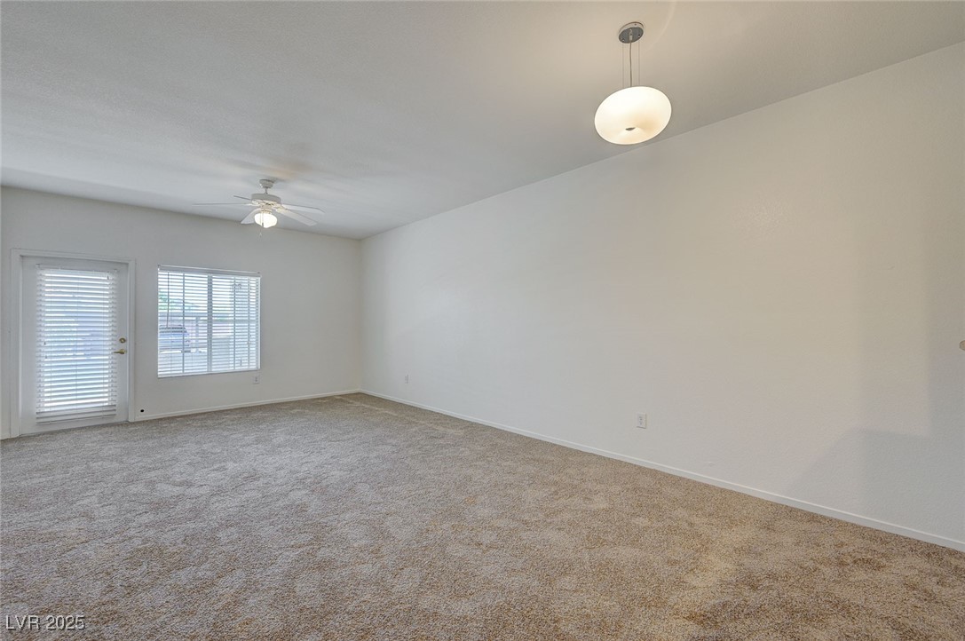 6160 Rumrill Street, Unit 232 Las Vegas, NV 89113 - Photo 6 of 26 Spare room featuring light carpet and ceiling fan