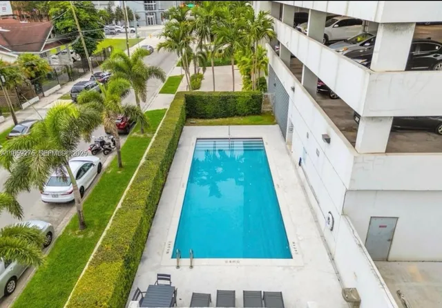 a living room with furniture and pool table