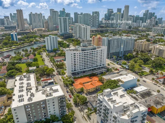 a kitchen with granite countertop a sink stainless steel appliances and cabinets