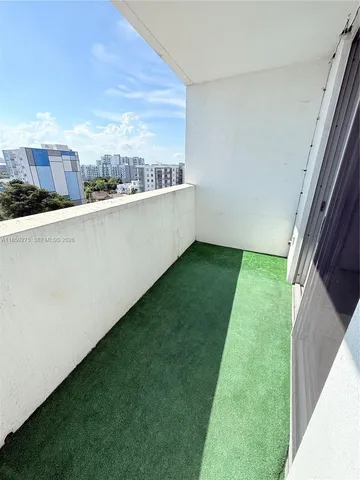 a kitchen with a refrigerator stove and microwave