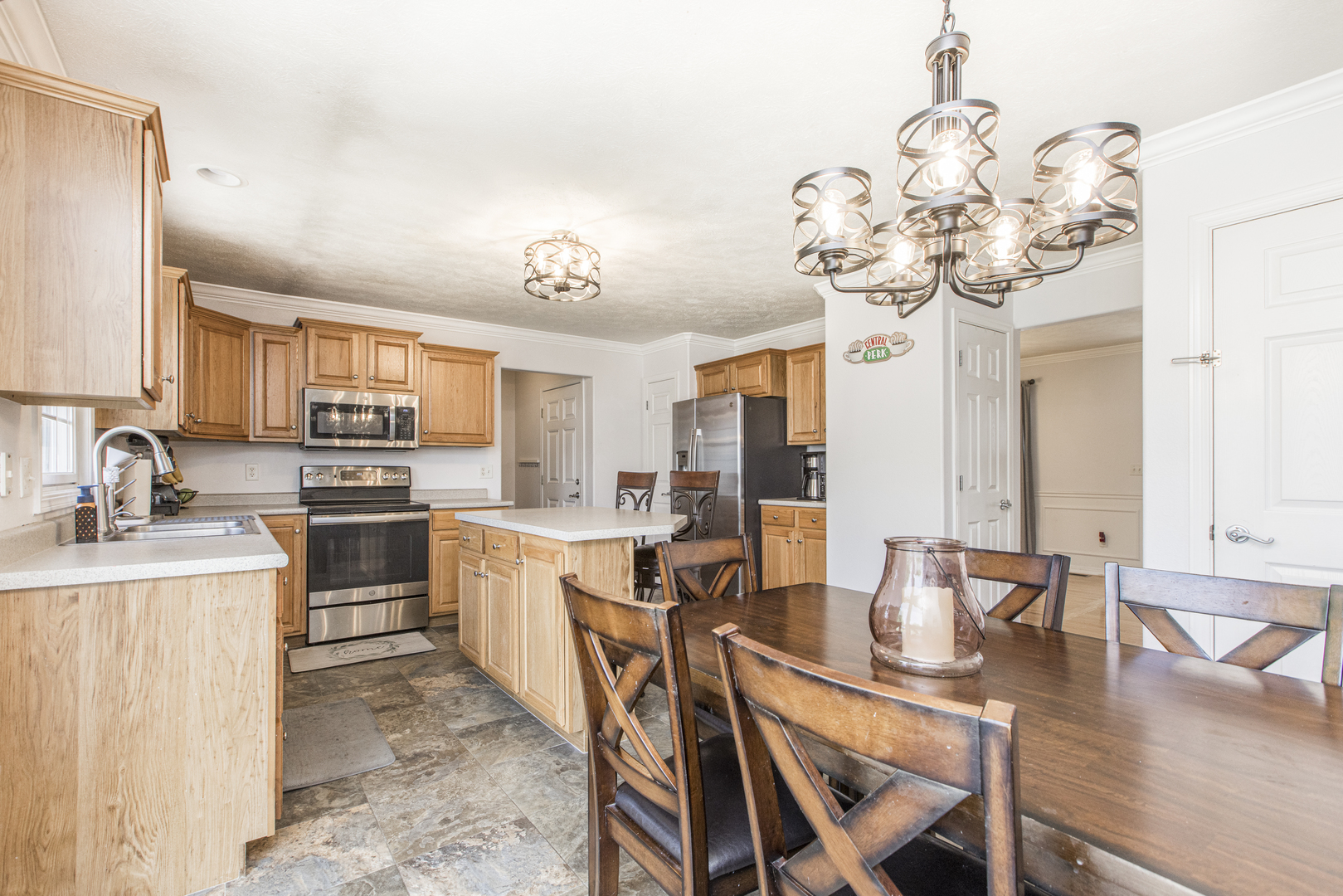 3230 Turquois Way Normal, IL 61761 - Photo 28 of 28 a kitchen with a dining table chairs sink and stove