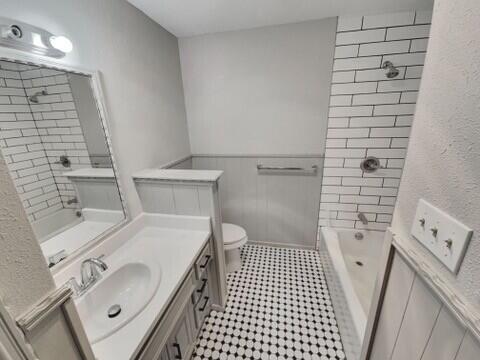3209 66th Street, Unit A Lubbock, TX 79413 - Photo 8 of 10 a bathroom with a sink toilet and shower