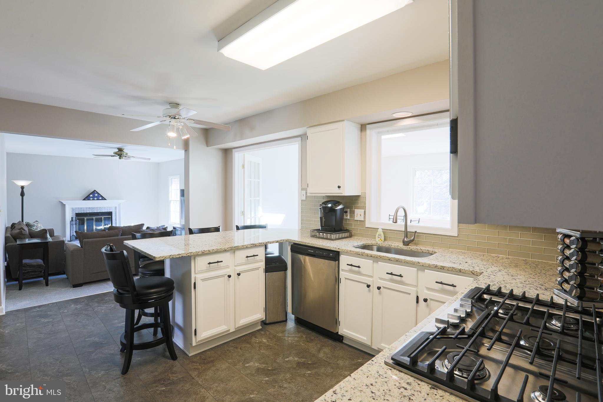 9547 Hallhurst Road Baltimore, MD 21236 - Photo 16 of 49 a kitchen with a sink appliances and cabinets