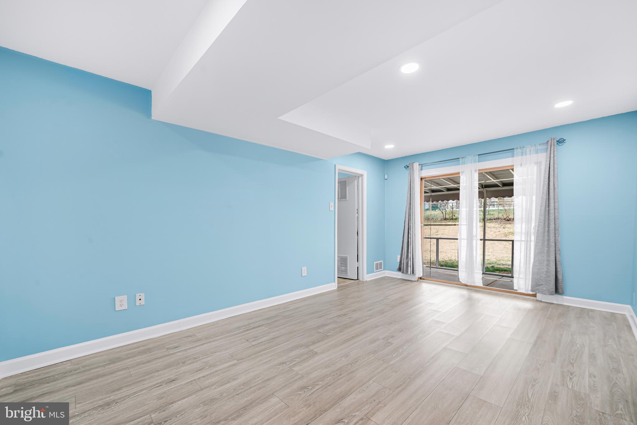 7958 Citadel Drive Severn, MD 21144 - Photo 16 of 32 a view of a livingroom with wooden floor