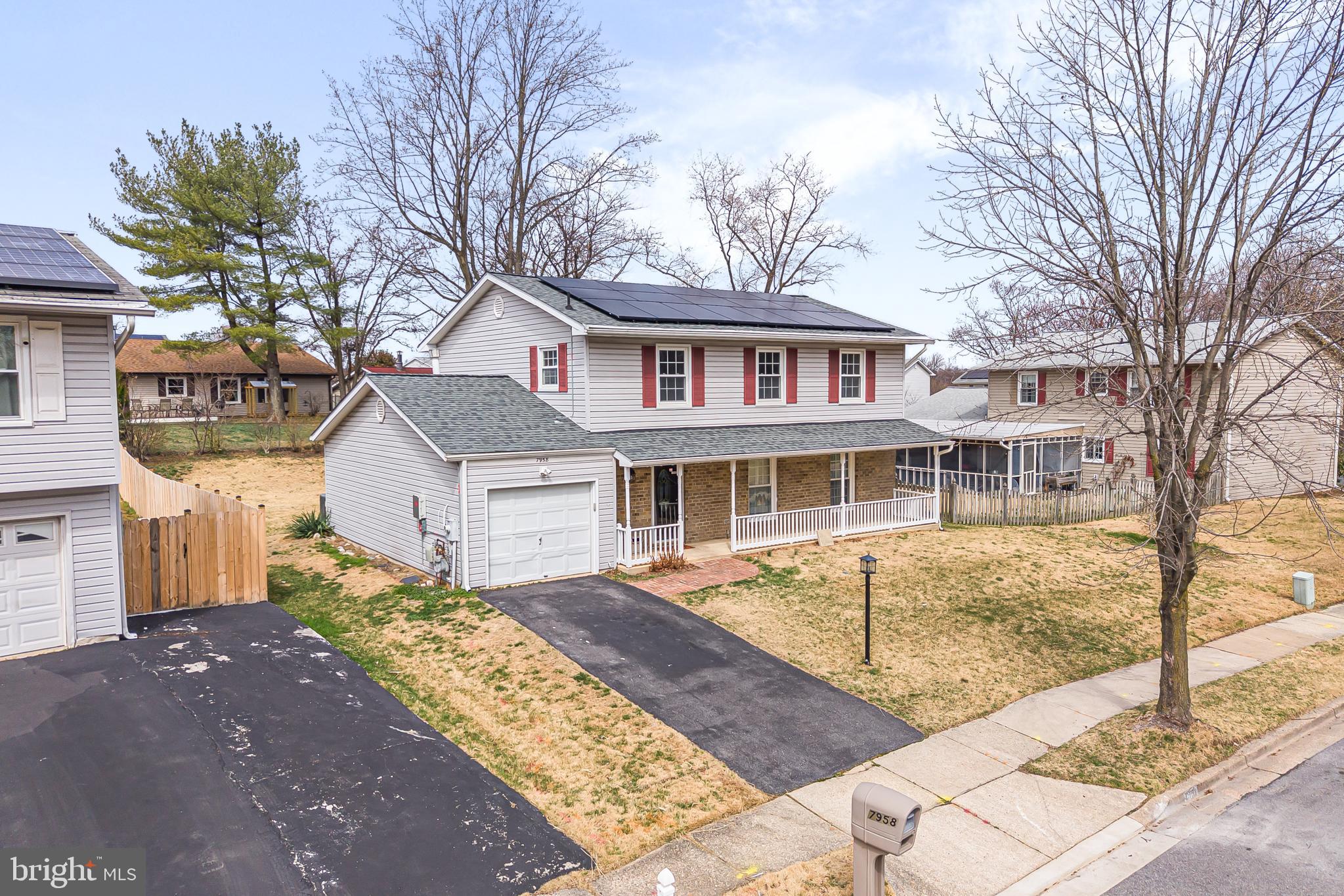 7958 Citadel Drive Severn, MD 21144 - Photo 2 of 32 a front view of a house with garden