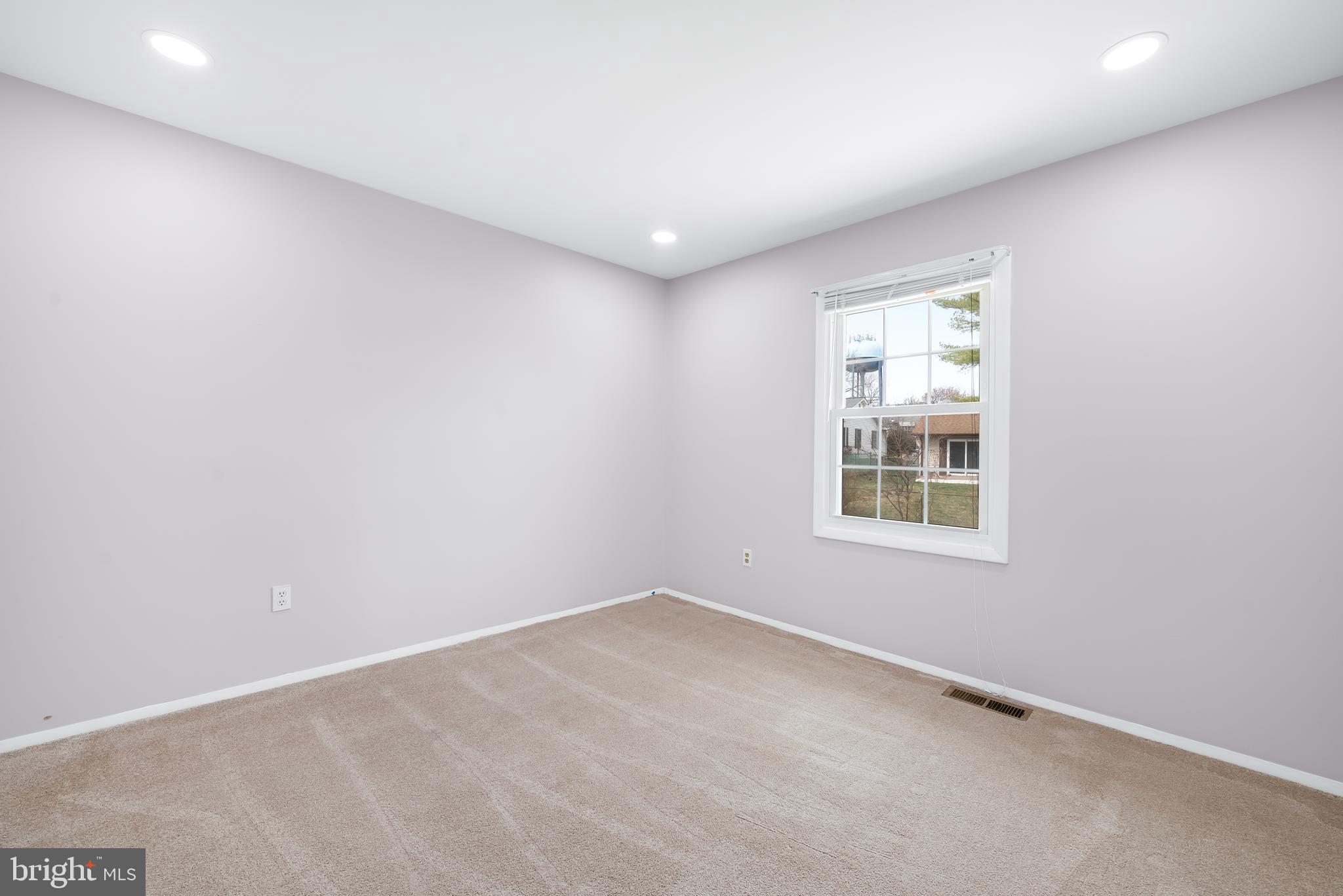 7958 Citadel Drive Severn, MD 21144 - Photo 21 of 32 an empty room with windows