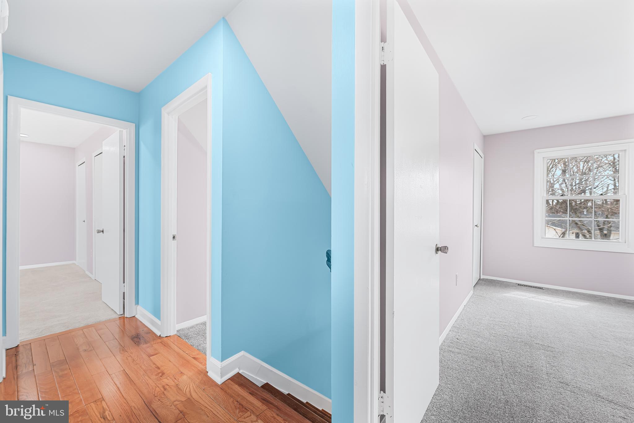 7958 Citadel Drive Severn, MD 21144 - Photo 22 of 32 a view of a hallway with wooden floor and closet