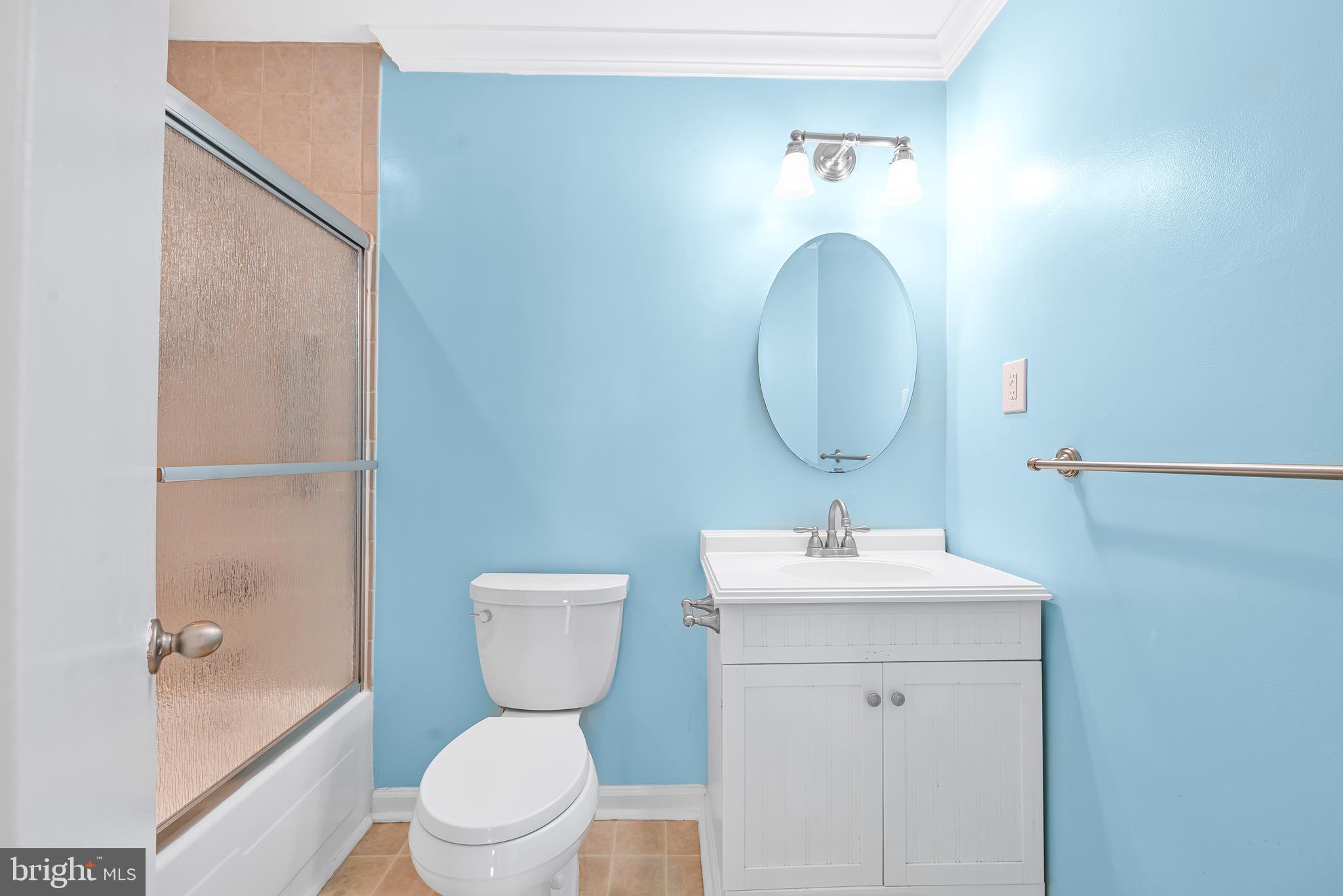 7958 Citadel Drive Severn, MD 21144 - Photo 23 of 32 a bathroom with a sink toilet and a mirror