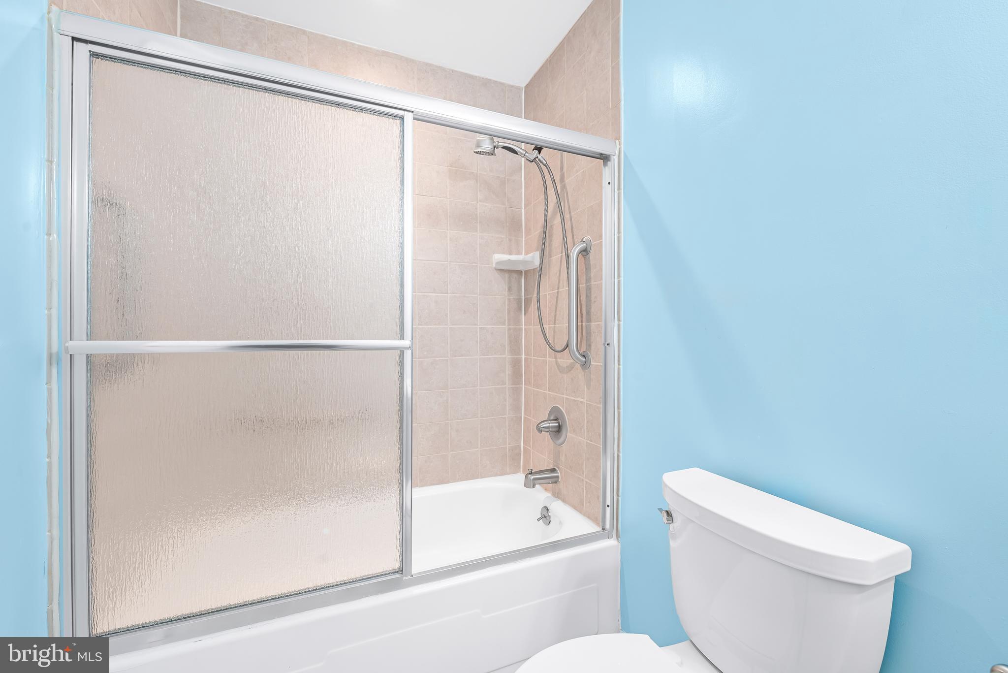 7958 Citadel Drive Severn, MD 21144 - Photo 24 of 32 a bathroom with a shower and a toilet