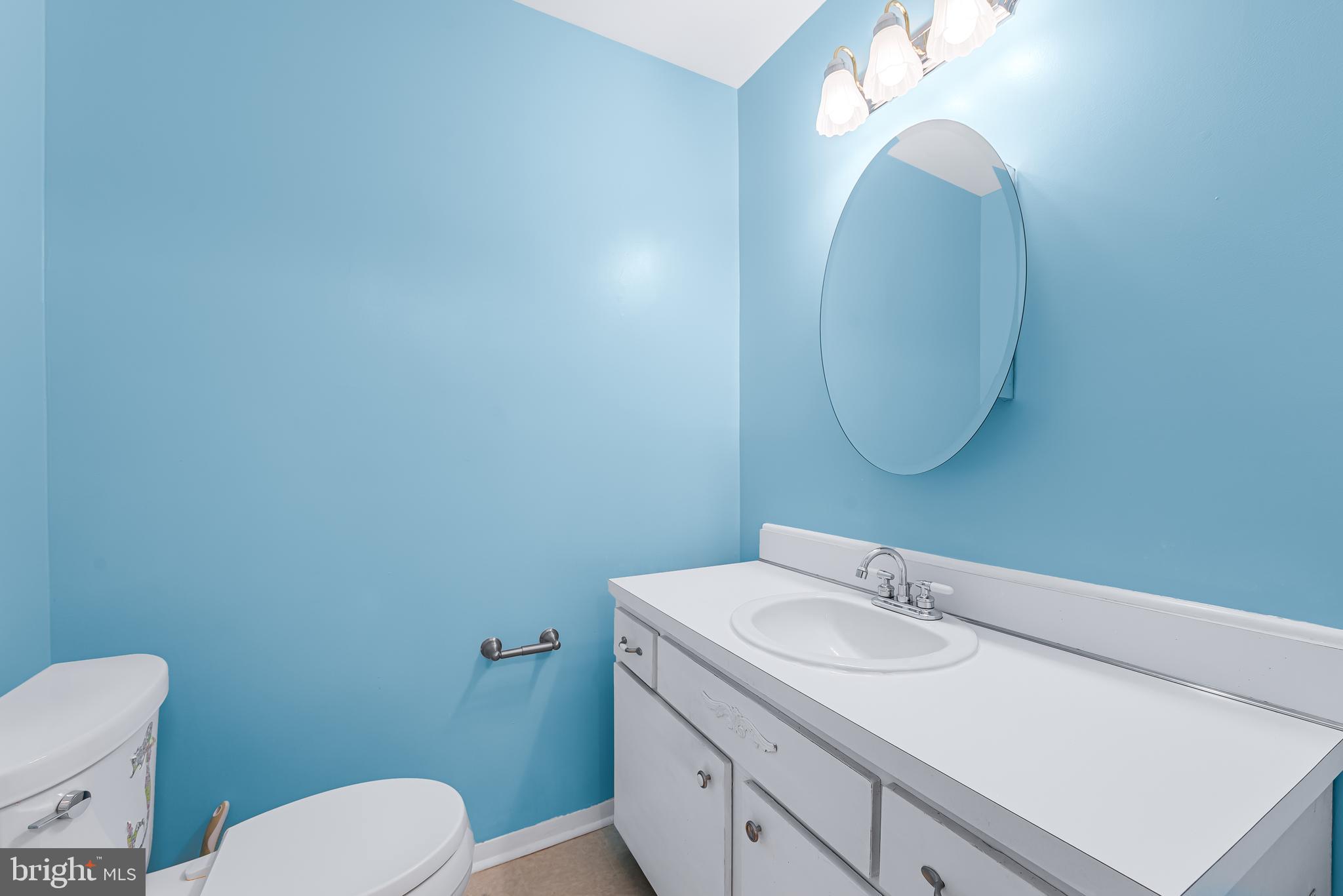 7958 Citadel Drive Severn, MD 21144 - Photo 6 of 32 a bathroom with a sink vanity mirror and toilet