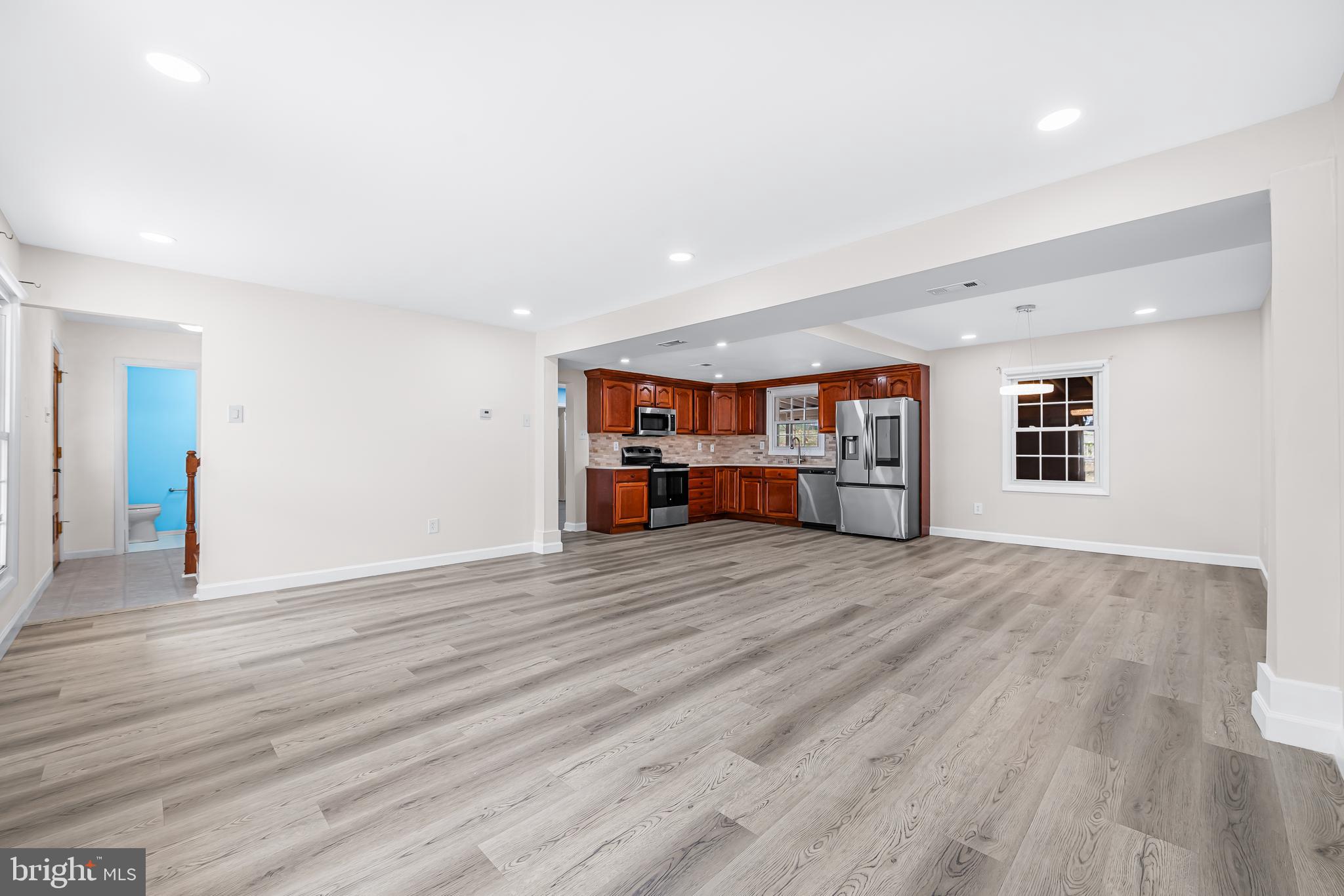 7958 Citadel Drive Severn, MD 21144 - Photo 8 of 32 a view of empty room with wooden floor