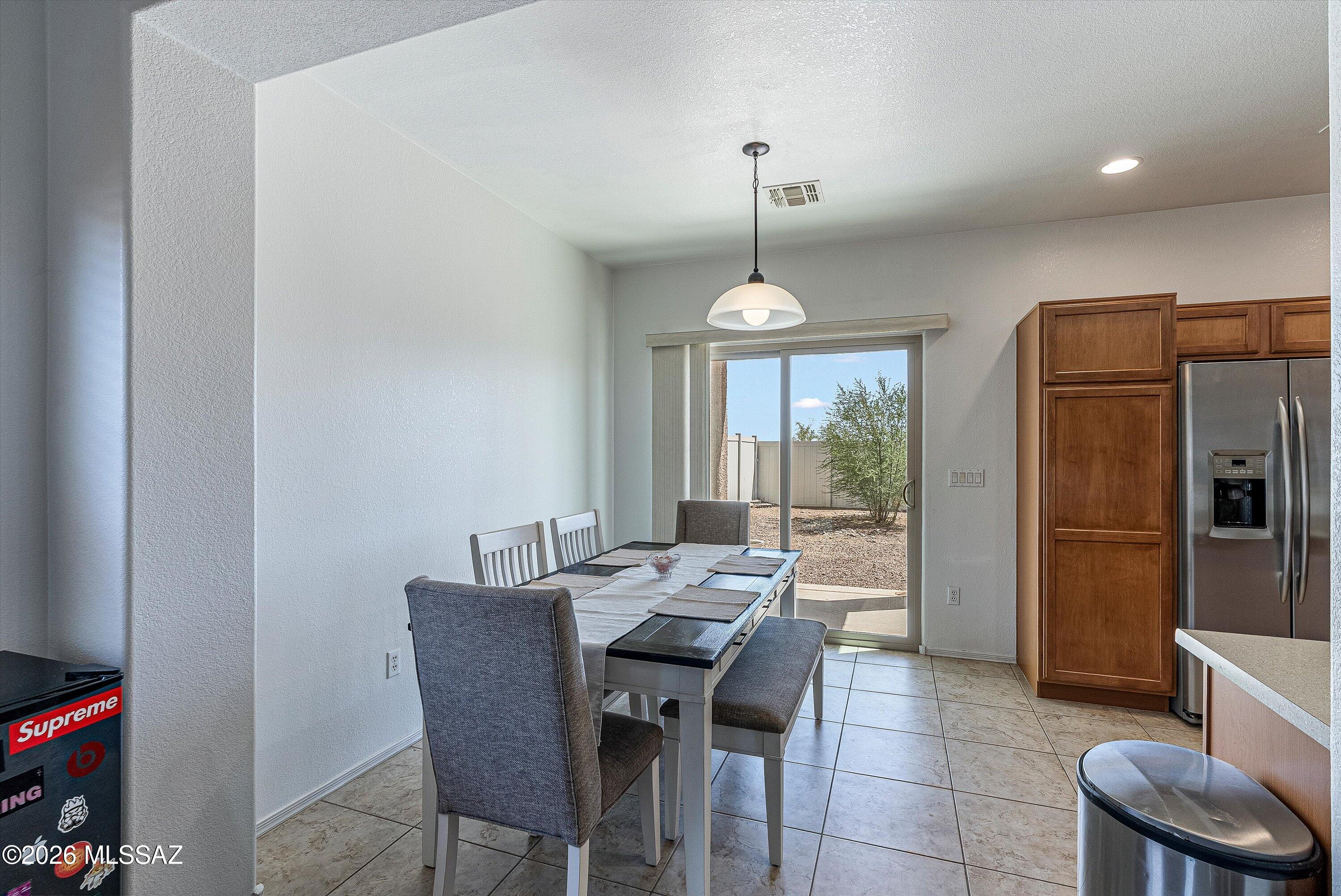 21163 East Treasure Road Red Rock, AZ 85145 - Photo 8 of 35 a view of a dining room with furniture window and outside view