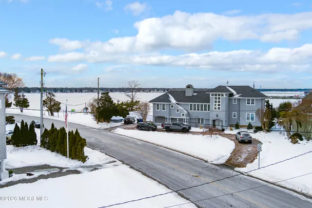 a view of multiple houses with a street
