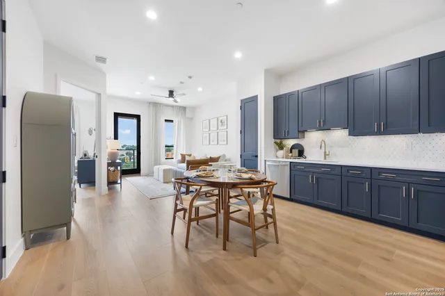 a kitchen with a table and chairs