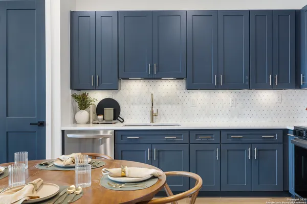 a kitchen with a sink and wooden cabinets