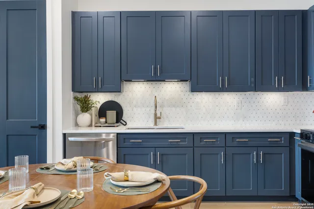 a kitchen with a sink and wooden cabinets