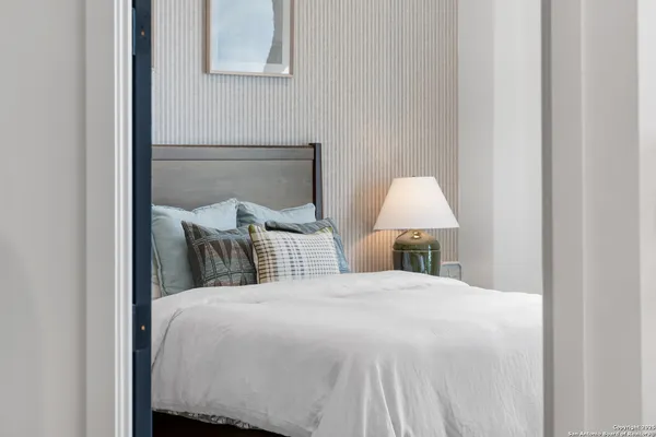 a bed room with a bed and a night stand