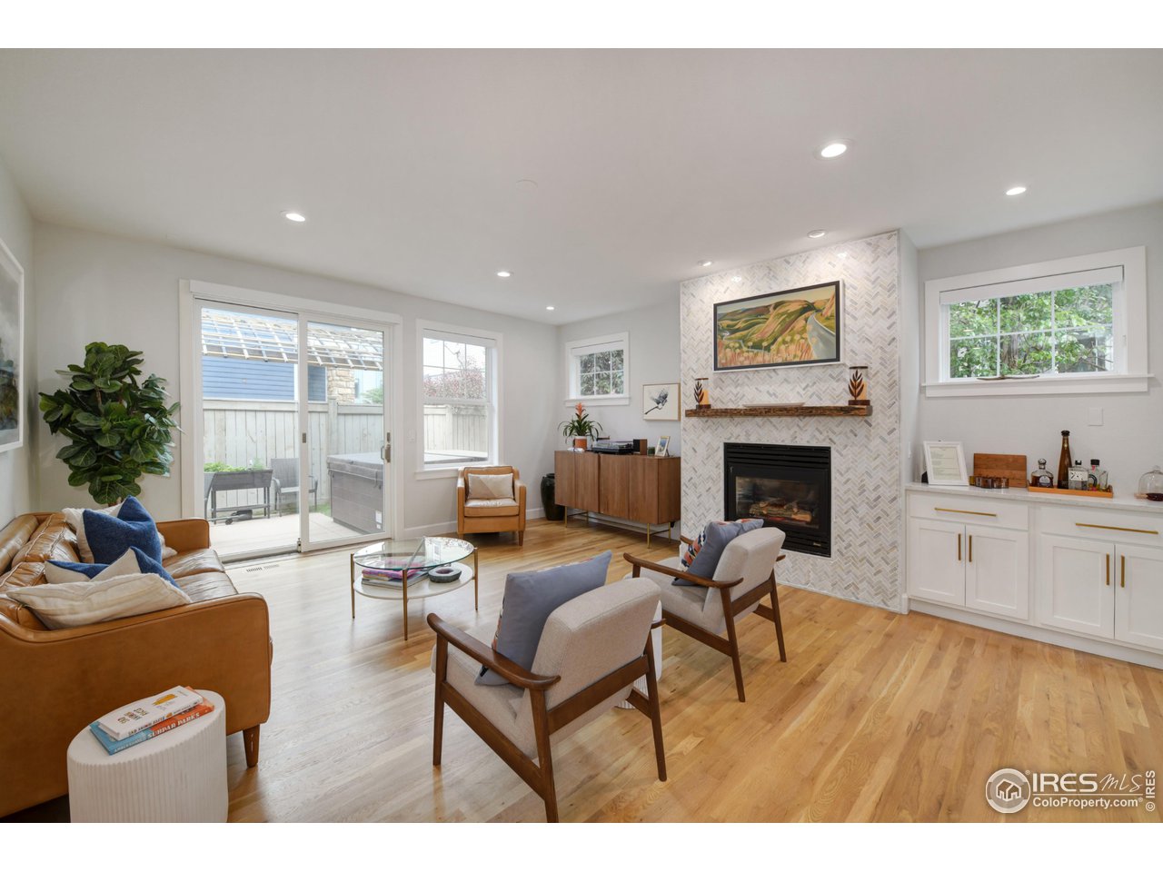755 Terrace Circle South Boulder, CO 80304 - Photo 12 of 38 a living room with furniture and a fireplace