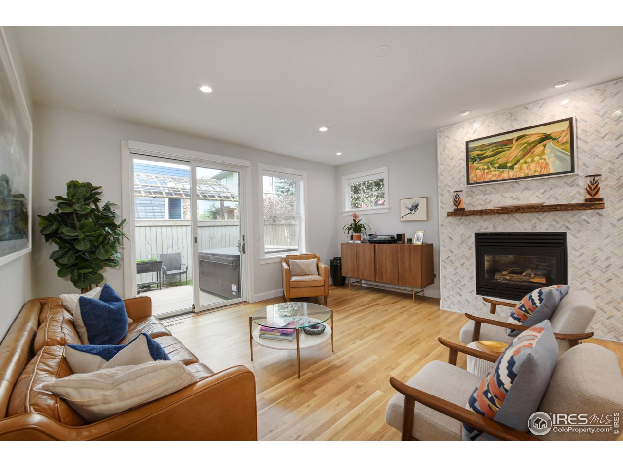 755 Terrace Circle South Boulder, CO 80304 - Photo 16 of 38 a living room with furniture and a fireplace