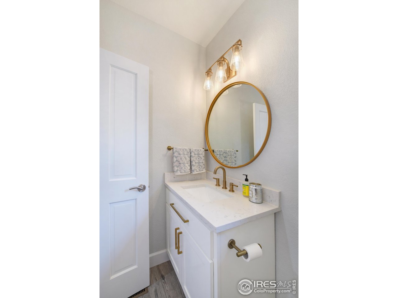 755 Terrace Circle South Boulder, CO 80304 - Photo 17 of 38 a bathroom with a sink mirror vanity and toilet