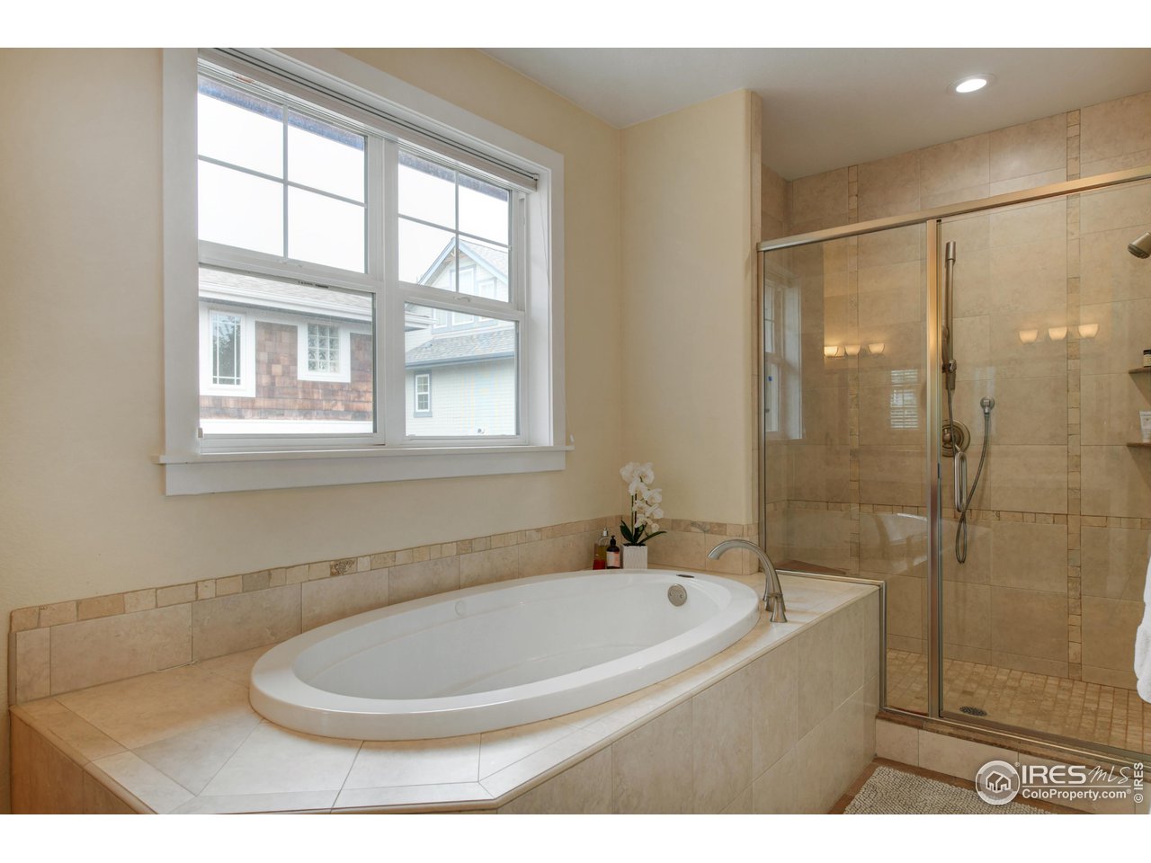 755 Terrace Circle South Boulder, CO 80304 - Photo 26 of 38 a bathroom with a bathtub and a shower