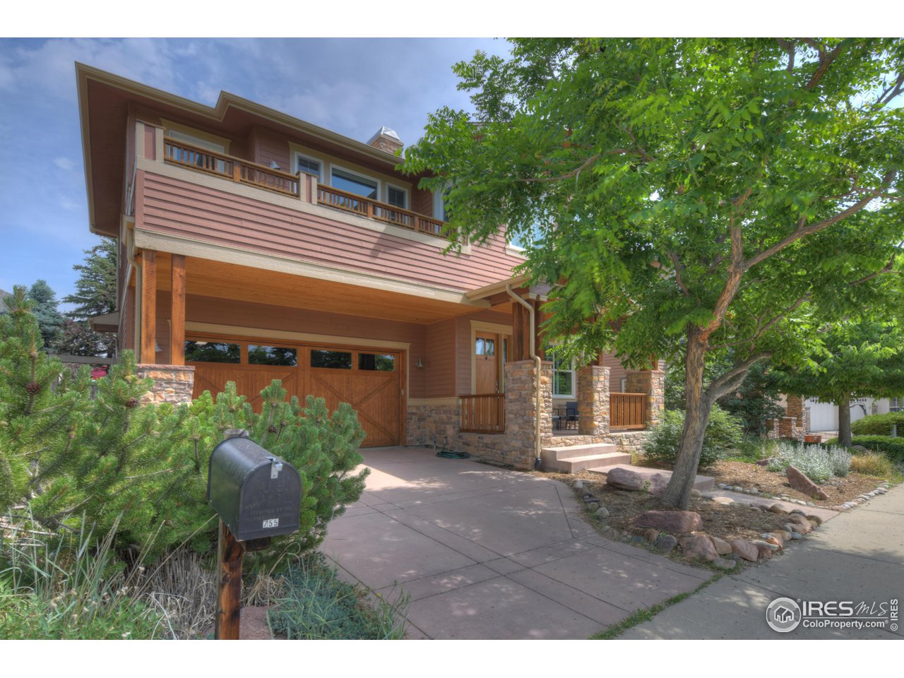 755 Terrace Circle South Boulder, CO 80304 - Photo 3 of 38 a view of a house with a yard and potted plants