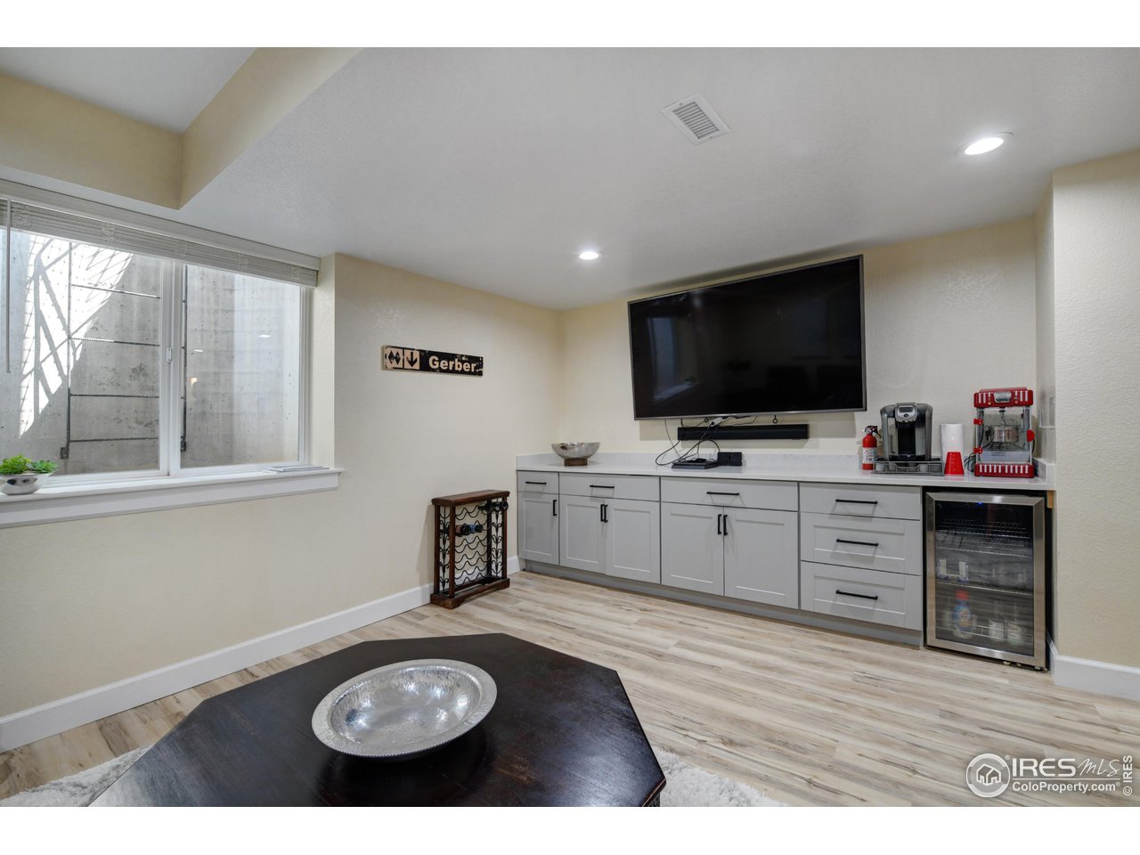 755 Terrace Circle South Boulder, CO 80304 - Photo 31 of 38 a living room with furniture and a flat screen tv
