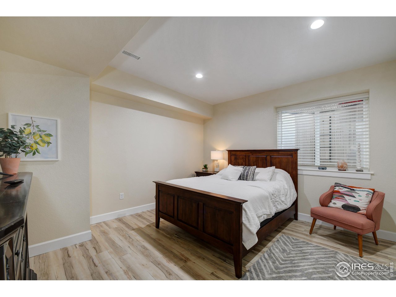 755 Terrace Circle South Boulder, CO 80304 - Photo 32 of 38 a bedroom with a bed and a potted plant