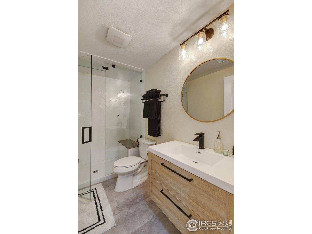 755 Terrace Circle South Boulder, CO 80304 - Photo 33 of 38 a bathroom with a sink and a mirror